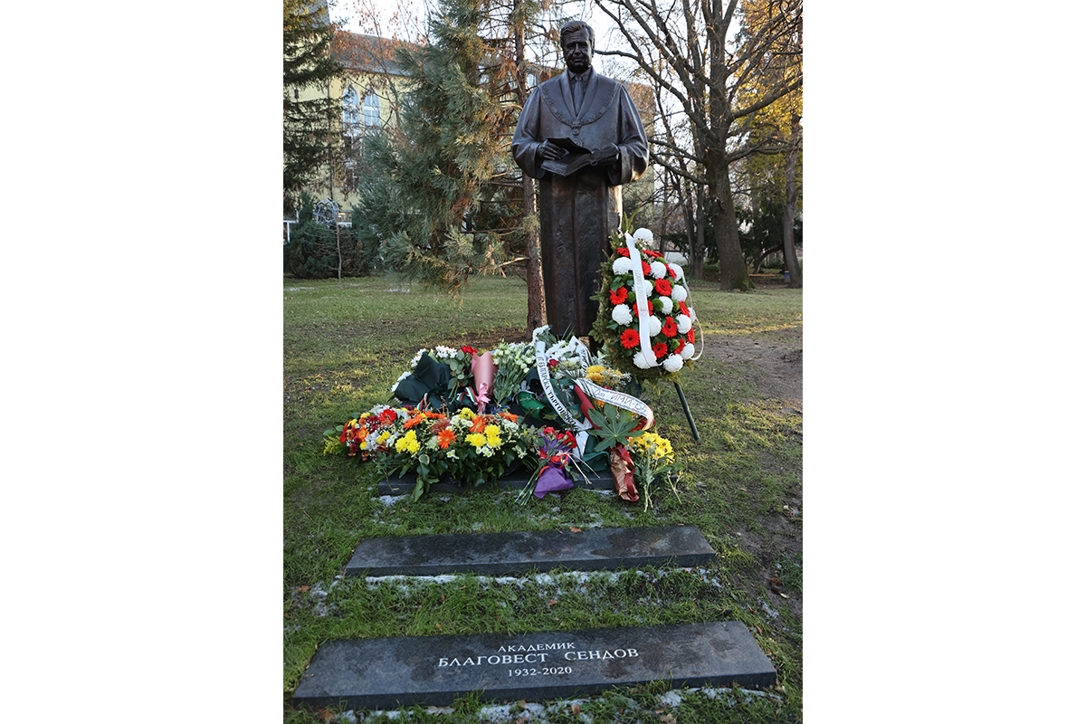 Flowers placed in front of monument.